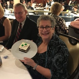 Women holding cake